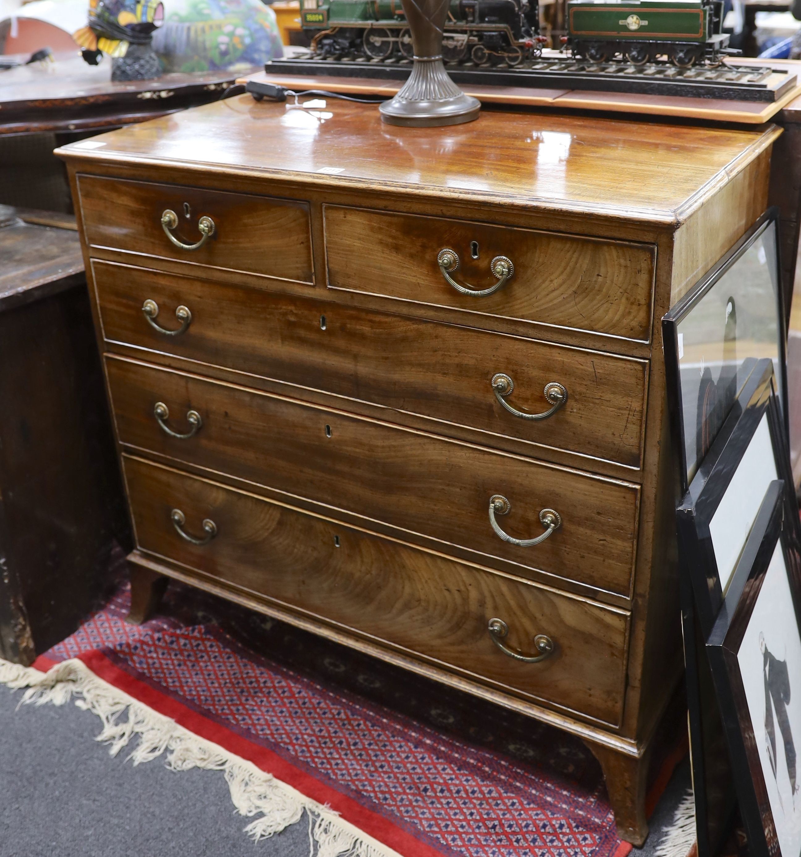 A George III mahogany chest, fitted two short and three long oak lined drawers, width 95cm, depth 51cm, height 89cm